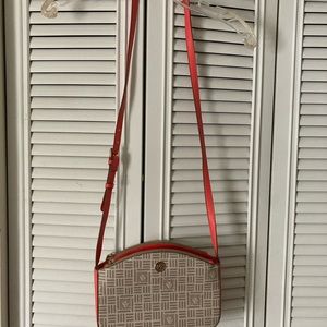 Anne Klein Cross Body Bag. Gold fixings against a nude and pinkish orange peach